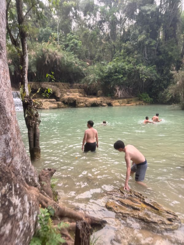 Blogger and friend in Kuang Si waterfall