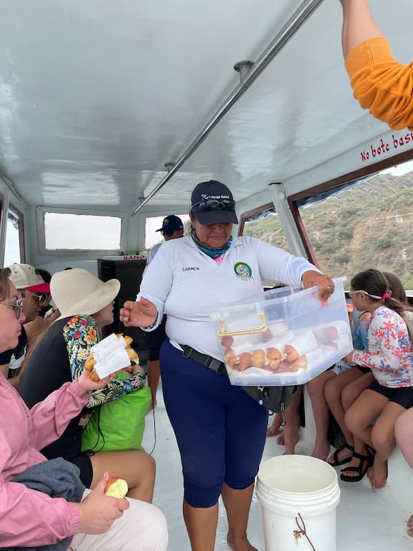 Tour staff giving out sandwiches