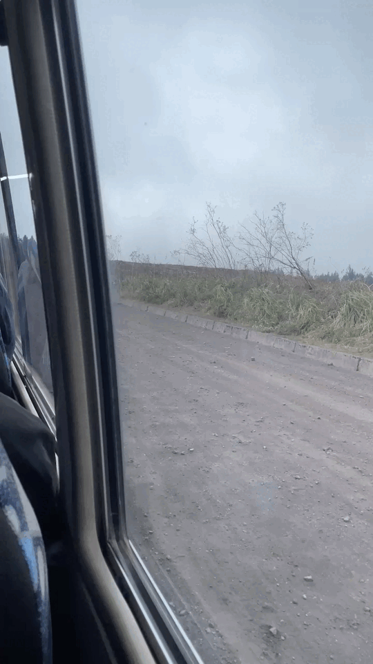 A bumpy van ride on a dirt road