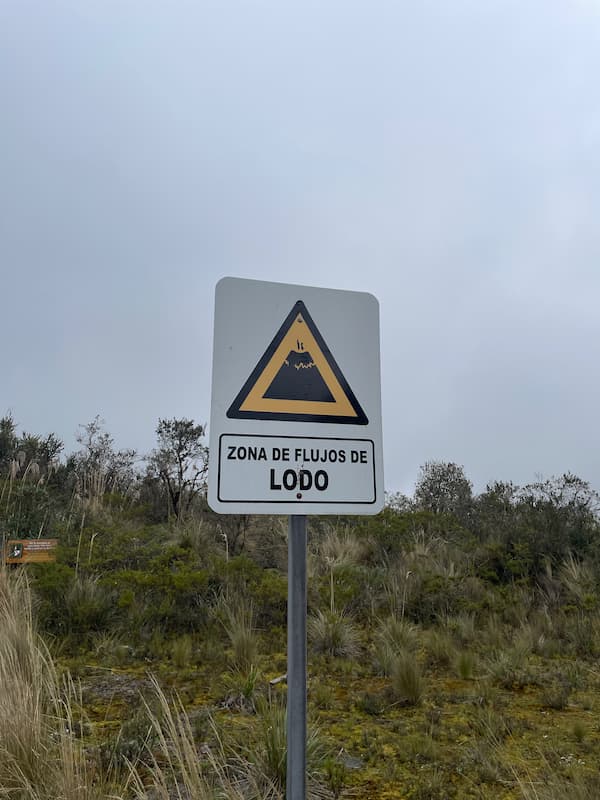 The street sign alerting that from here is mudflow hazard zone