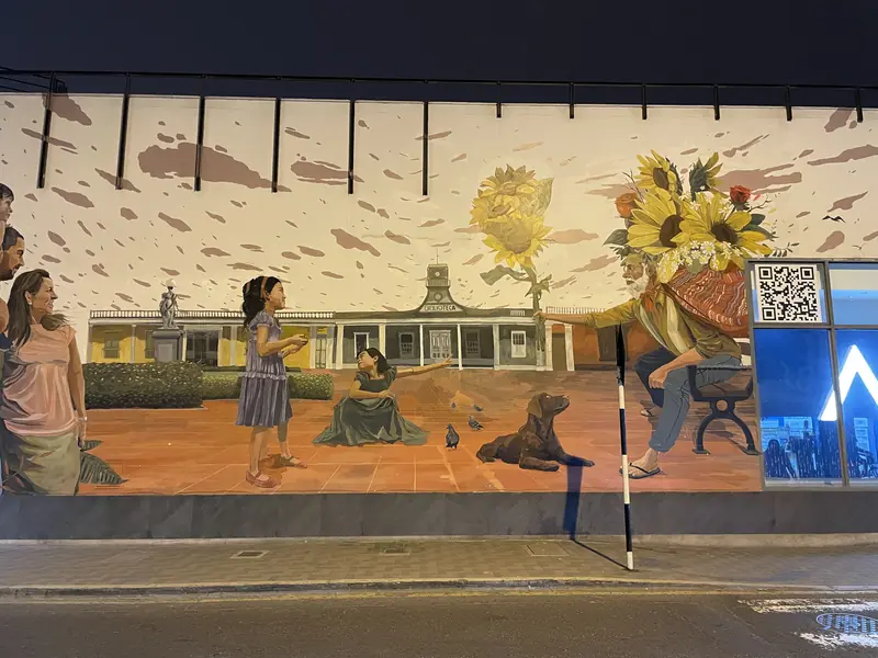 소녀에게 해바라기를 전달하는 그라피티